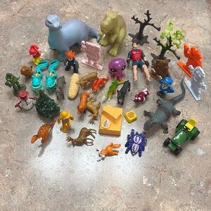 Lot if small kids toy figures.
